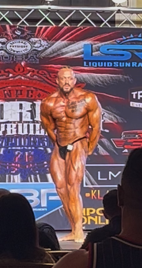 Derek Cundiff competing on a bodybuilding stage