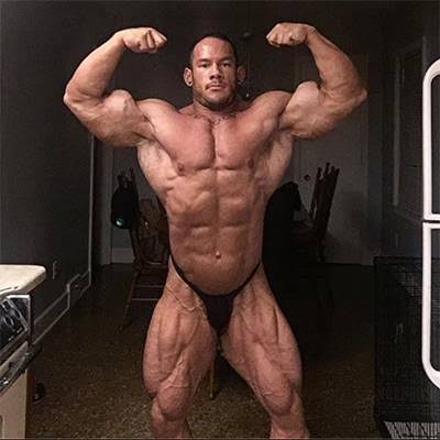 IFBB Pro Shawn Smith practicing a bodybuilding front double-biceps pose